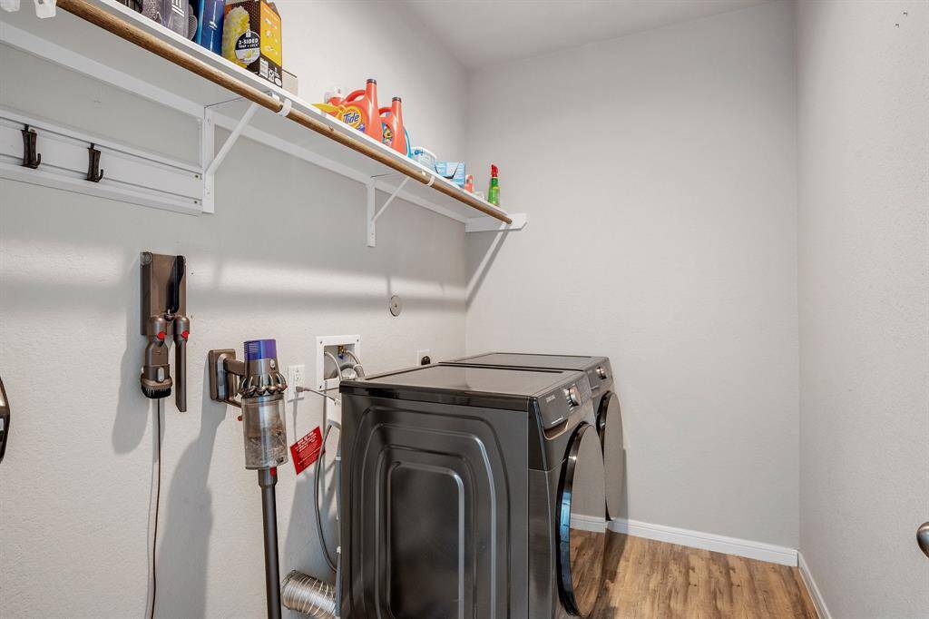 This laundry room is big! It has all the room you need to do all your laundry!