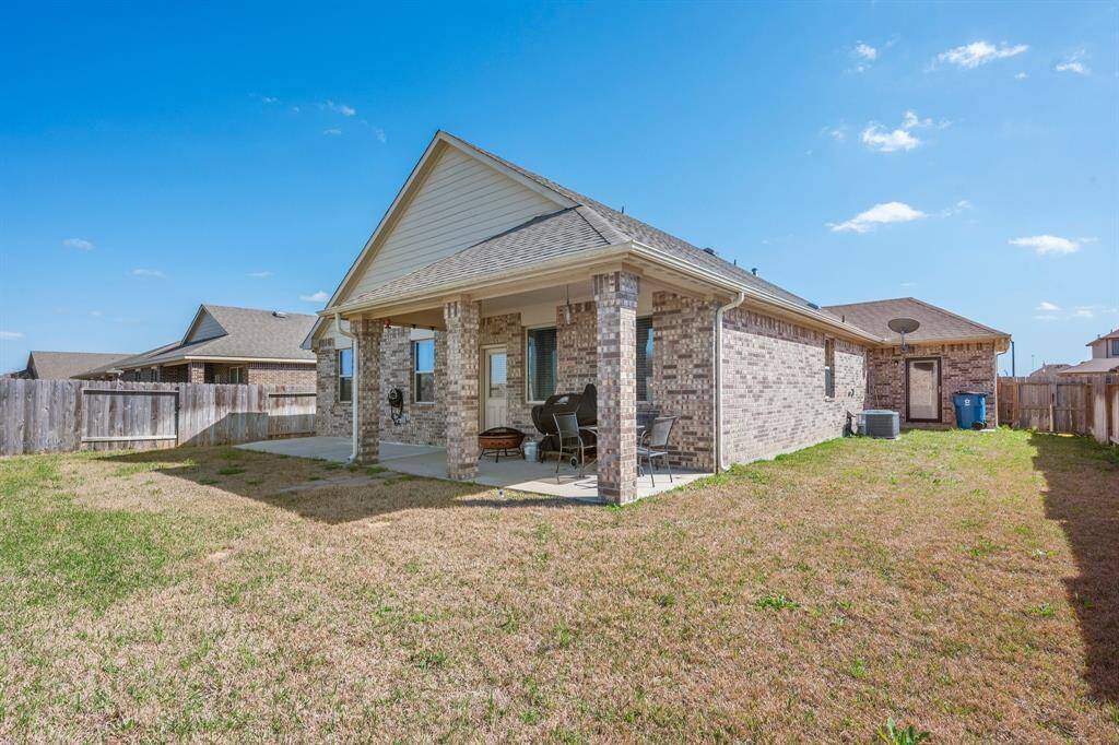 The back yard is a nice retreat for BBQs or other gatherings.