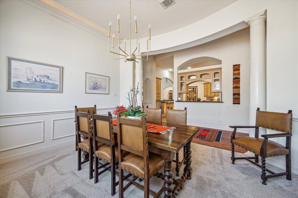Formal Dining with coffered ceiling with underlighting.  Updated lighting