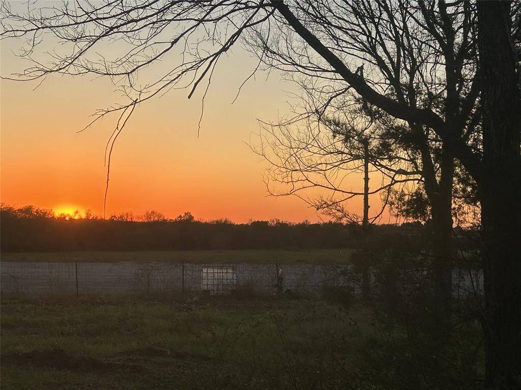 View of sunset from property