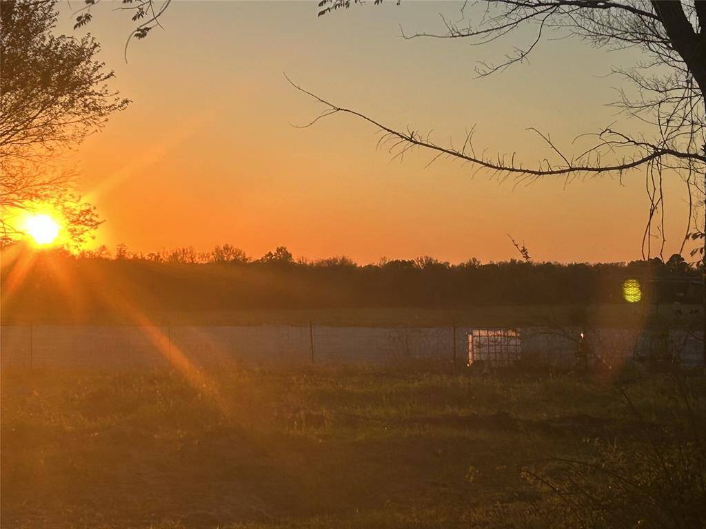 View of sunset from property