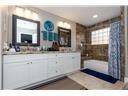 Large primary bathroom with dual sinks