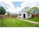 Huge yard for any kind of activities with private brick fence.