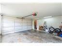 Large two car garage with extra storage space.