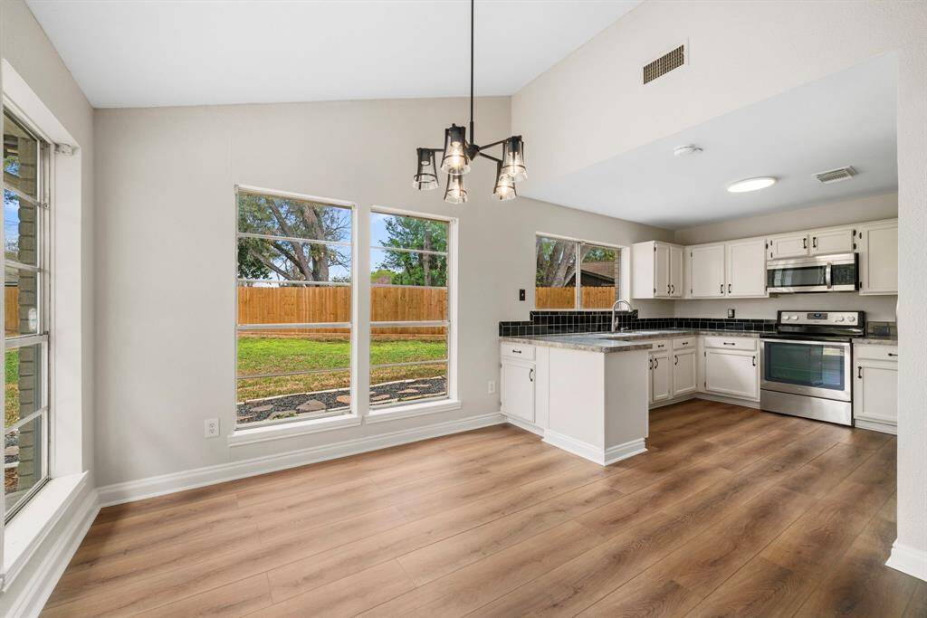 Bright Kitchen with view of yard