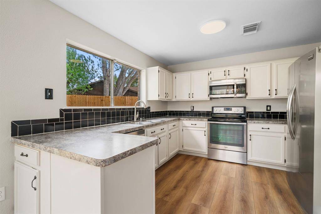 Kitchen has stainless appliances