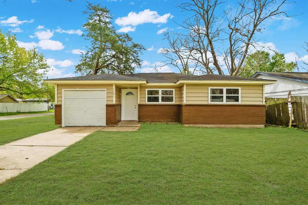 Here’s another angle so you can really take it in. The wide front lawn, the clean lines, the front window, this place has serious potential. Whether you’re looking for a smart investment or a home you can make your own, this one is it.