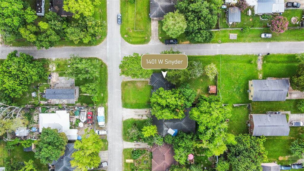 A bird's-eye view of the expansive backyard, revealing ample outdoor space for relaxation and activities.
