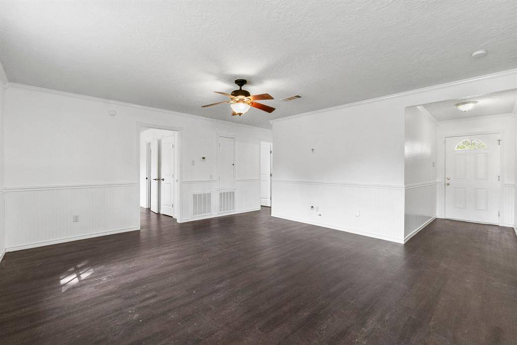 Looking back toward the front, you see it all—freshly painted trim, spotless floors, and that clean, move-in-ready vibe. Everything feels updated and fresh, just waiting for you to make it your own. Let’s be real—when a home looks this good, it won’t last.