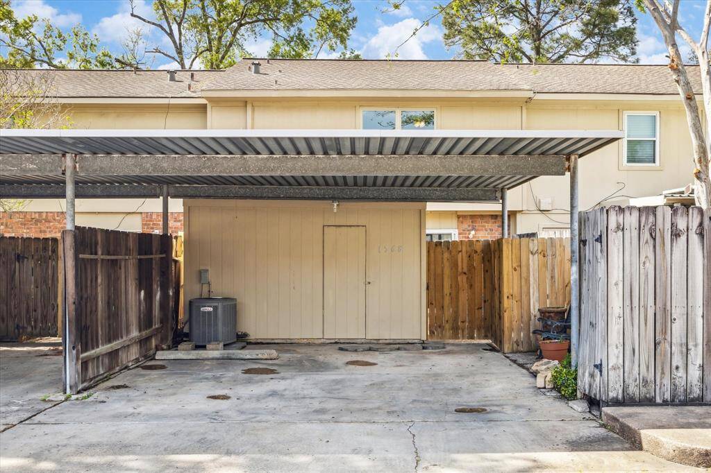 CARPORT WITH STORAGE AREA!