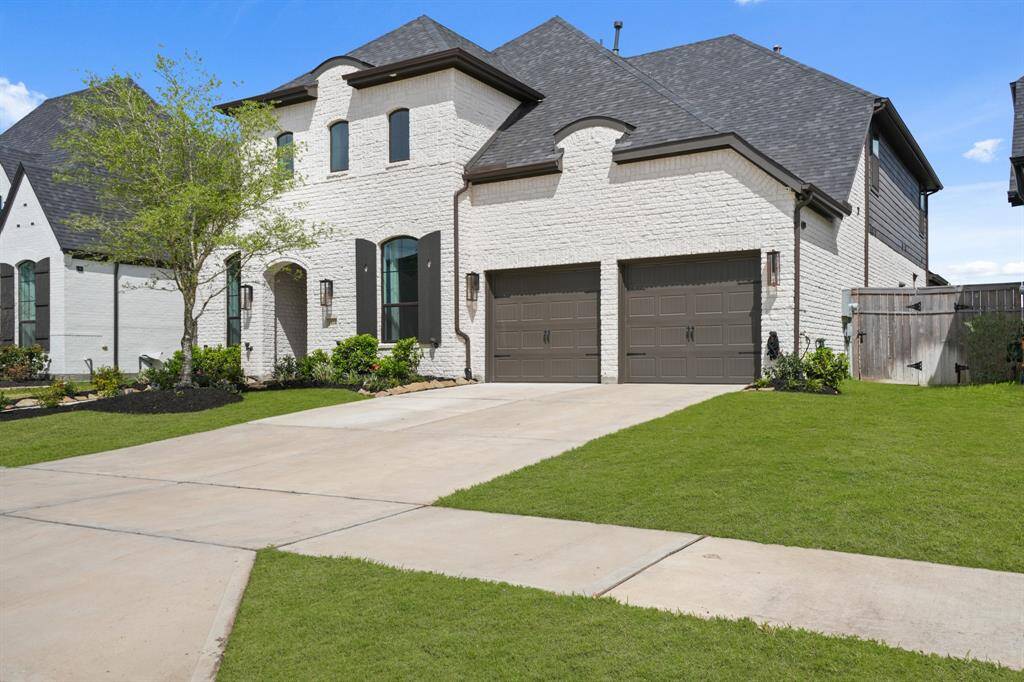 The three car tandem garage provides extra parking or extra storage...your pick.