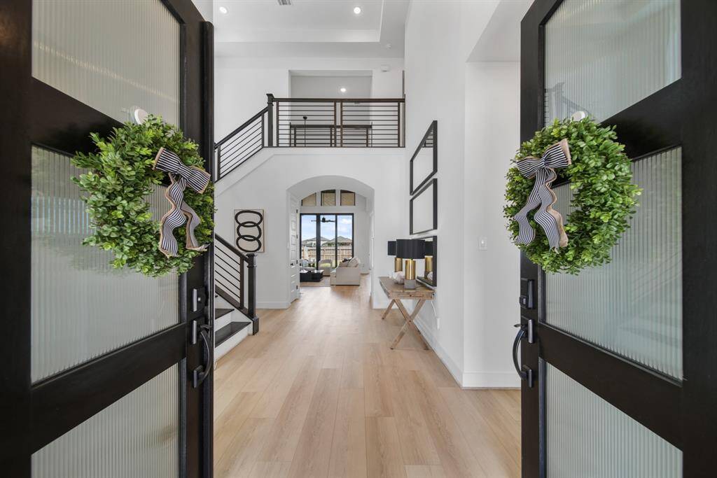 The double mahogany doors have privacy glass and open up to the most amazing interior.