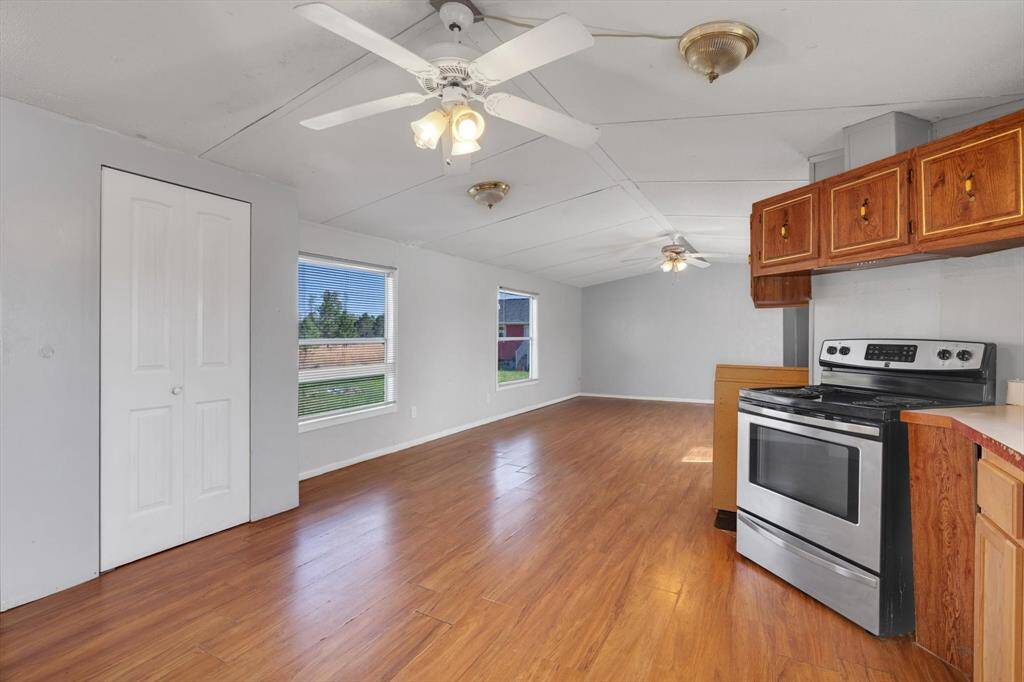 Spacious kitchen and dining area, abundant natural light, and modern appliances—perfect for entertaining and family gatherings.