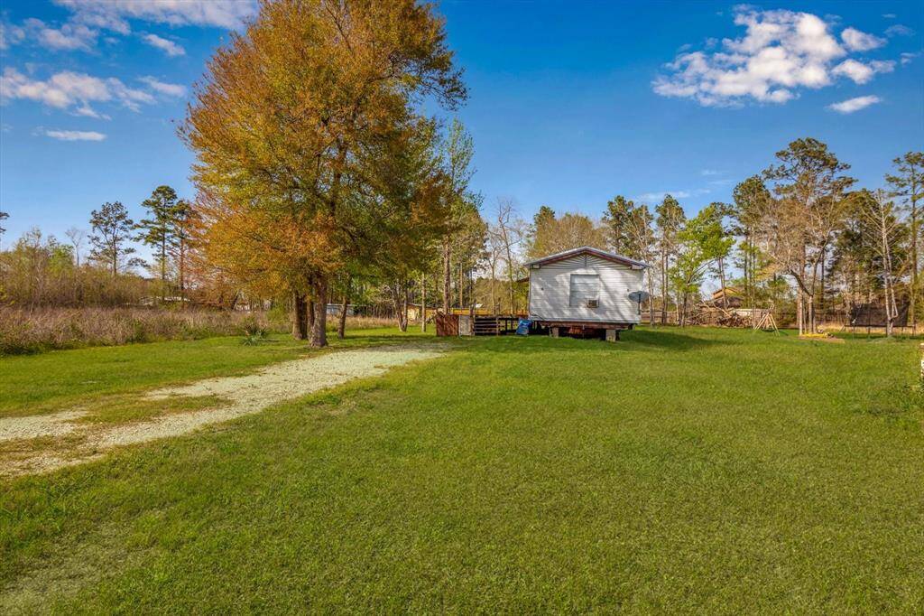 Expansive, driveway offers a serene approach to your countryside retreat.
