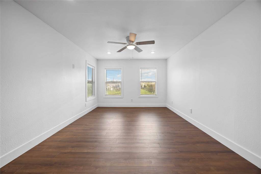 A bright spacious living room offers the perfect space to relax and unwind.