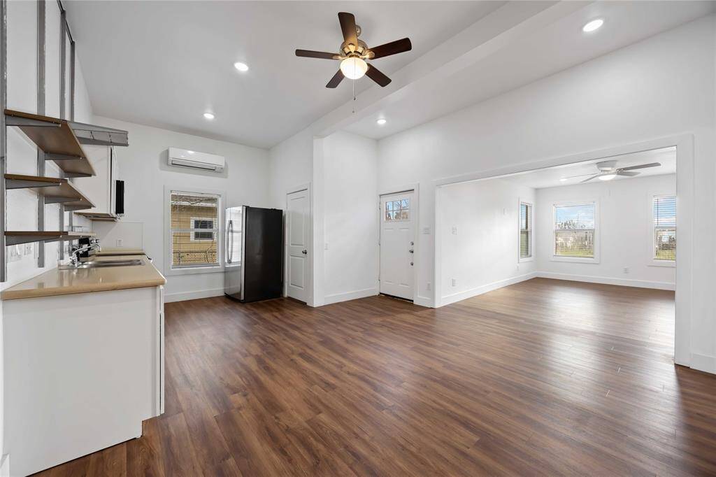 Beautiful wood-look laminate floors reflect the amazing natural light that illuminates the home.