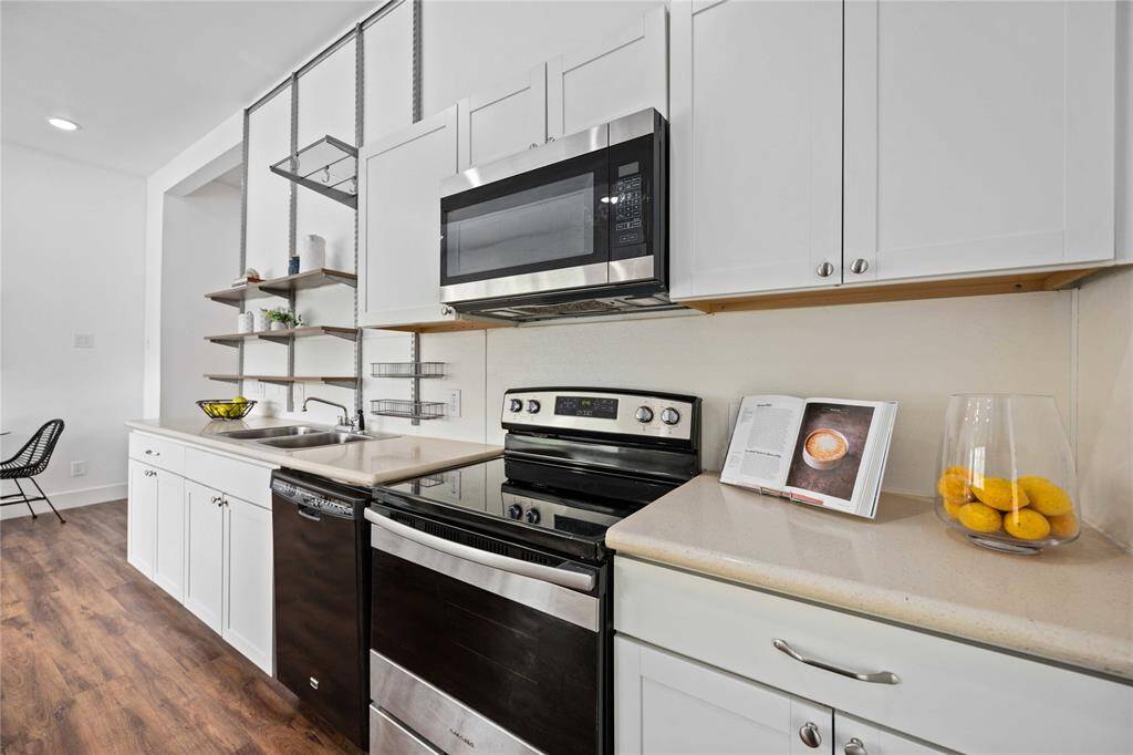 Stainless steel appliances are the perfect choice in this renovated space.