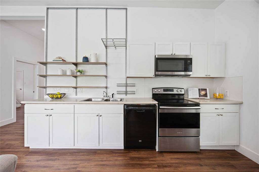Enjoy the counter space and storage in this streamlined kitchen. The refrigerator is included in the lease.