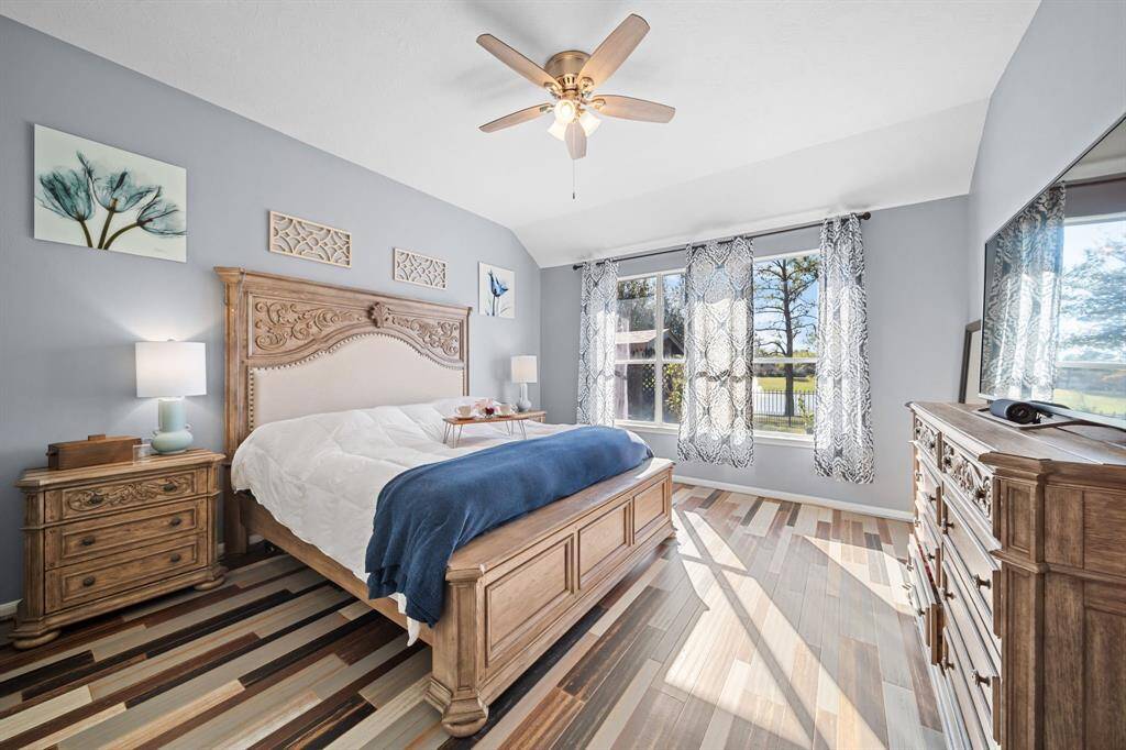 Primary bedroom with great views to back.  Unique bamboo flooring continues into primary.
