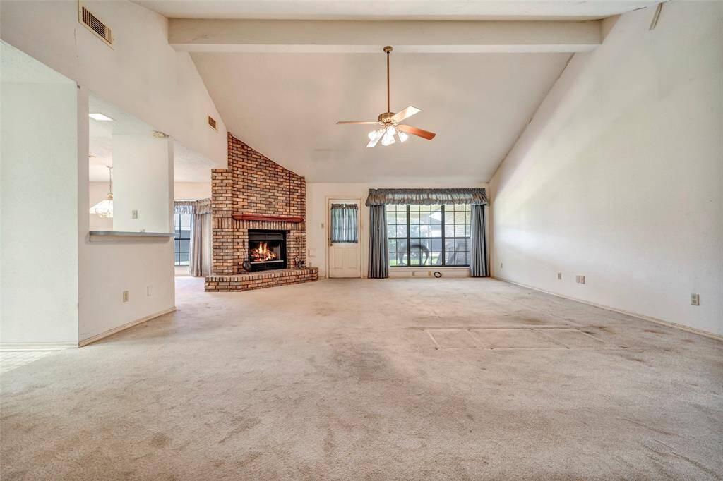 huge 20 x 22 living room with vaulted ceiling and fireplace