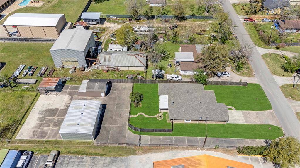 40' x 30' warehouse, 2 car garage, and carport in the back
