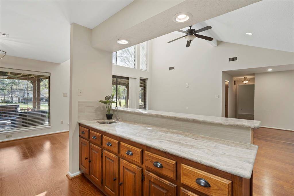 Expansive counter space and a bar sink are fabulous for entertaining.