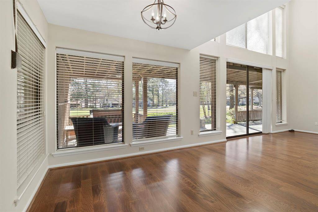 The breakfast area is surrounded by windows providing relaxing views and soft natural light.