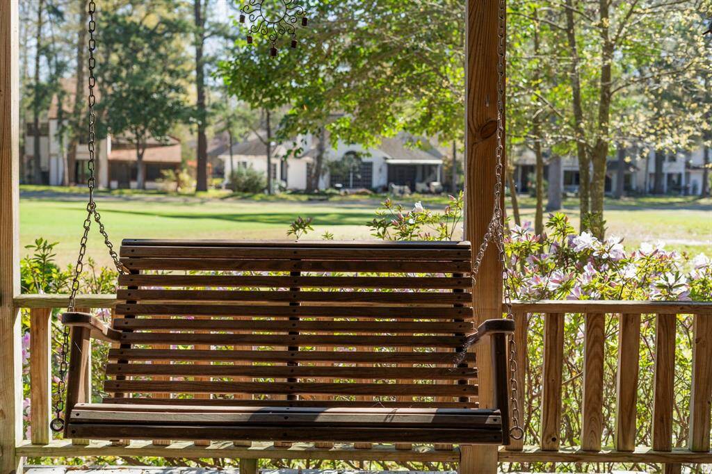 A porch swing adds a touch of charm and nostalgia.
