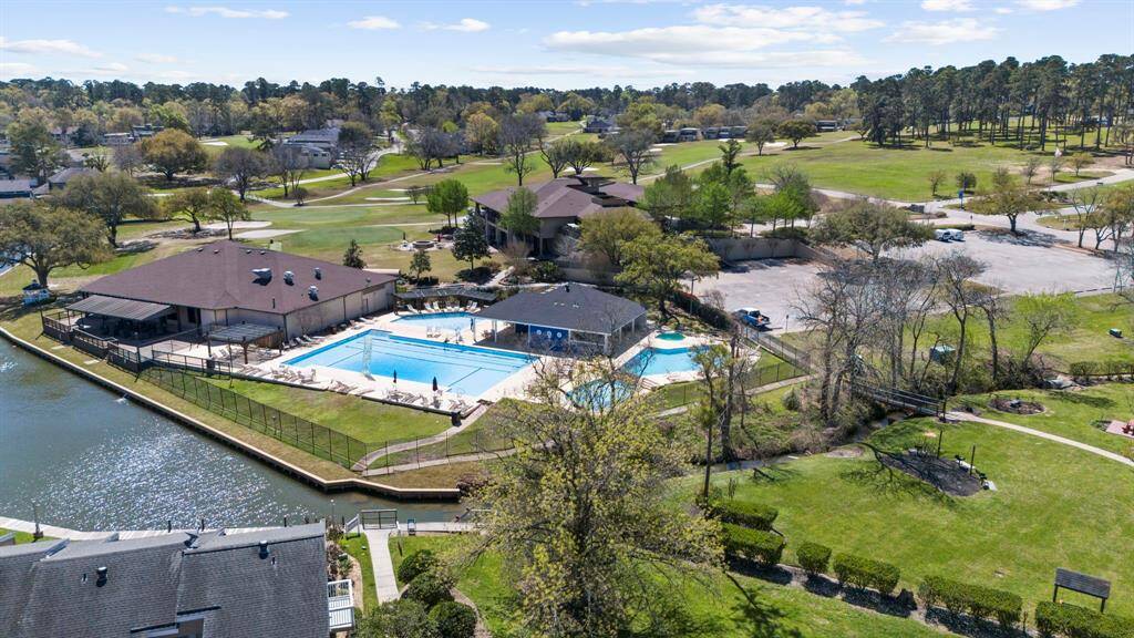Clubhouse and pools overlooking Lake Conroe.
