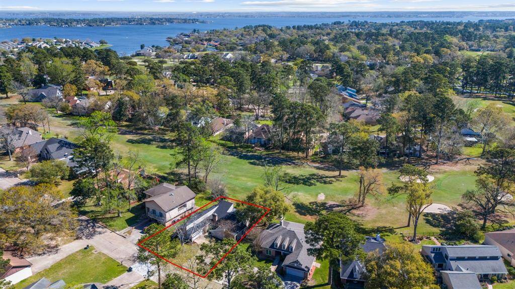 April Sound is a gated community known for its picturesque mature trees, breathtaking lake views, and a wide array of amenities, including a golf course, tennis courts, a pool, marina, and clubhouse.