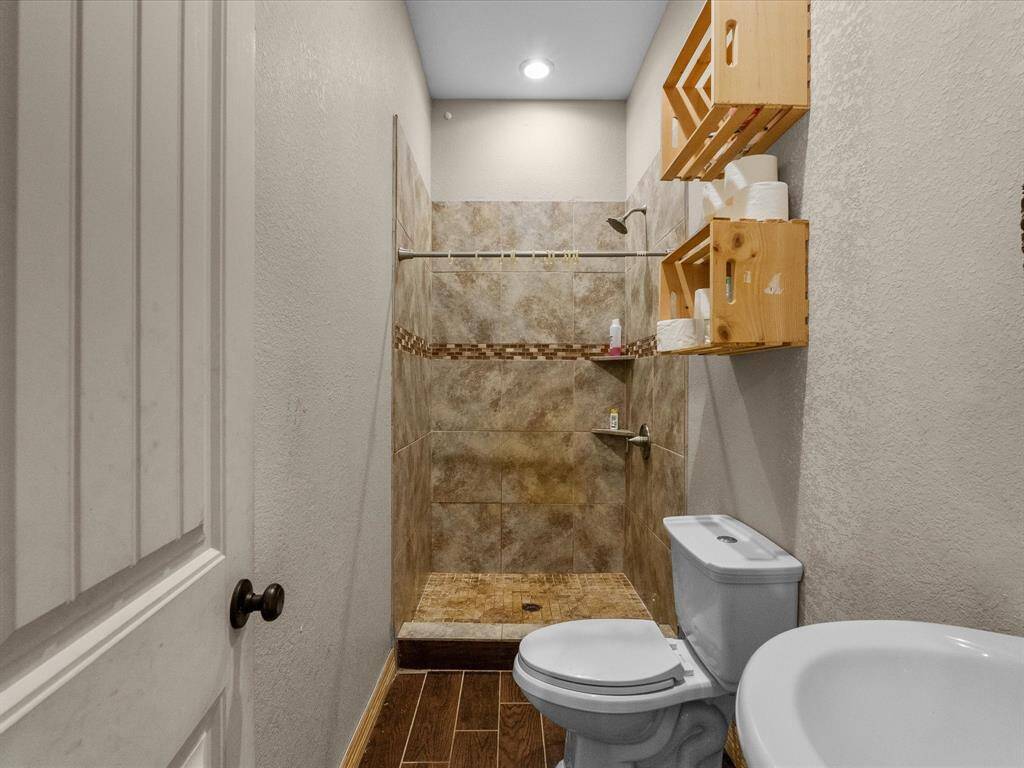 Full bathroom with tile shower