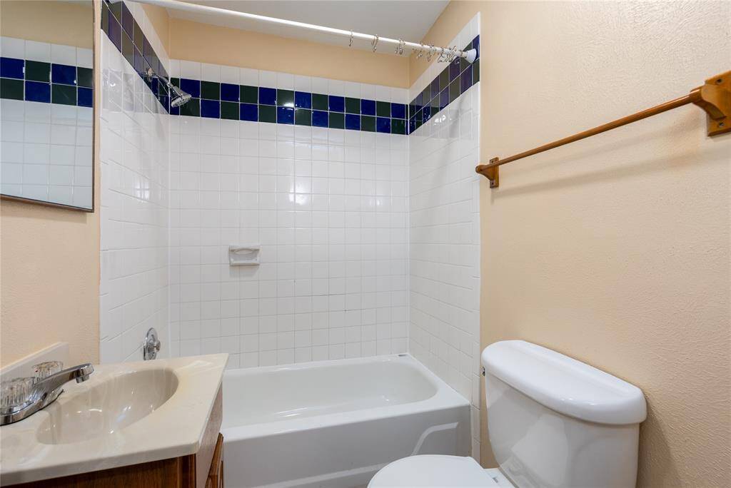 Updated bathroom with tile shower and recent vanity.