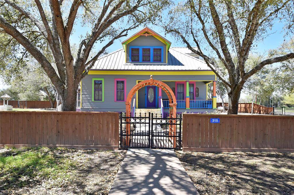 This is a magical place. Welcome to 315 Cedar in the sweet little town of New Ulm. Come on in the gate and see this amazing property.