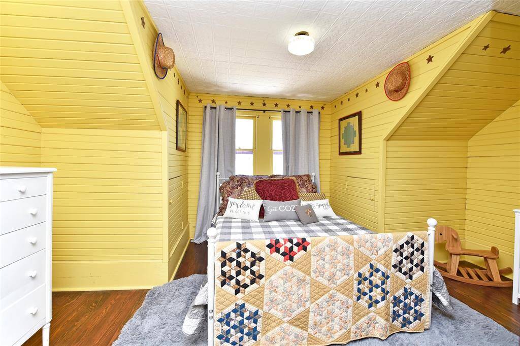 One of the upstairs bedrooms. This is a darling room. Perfect for your guests.