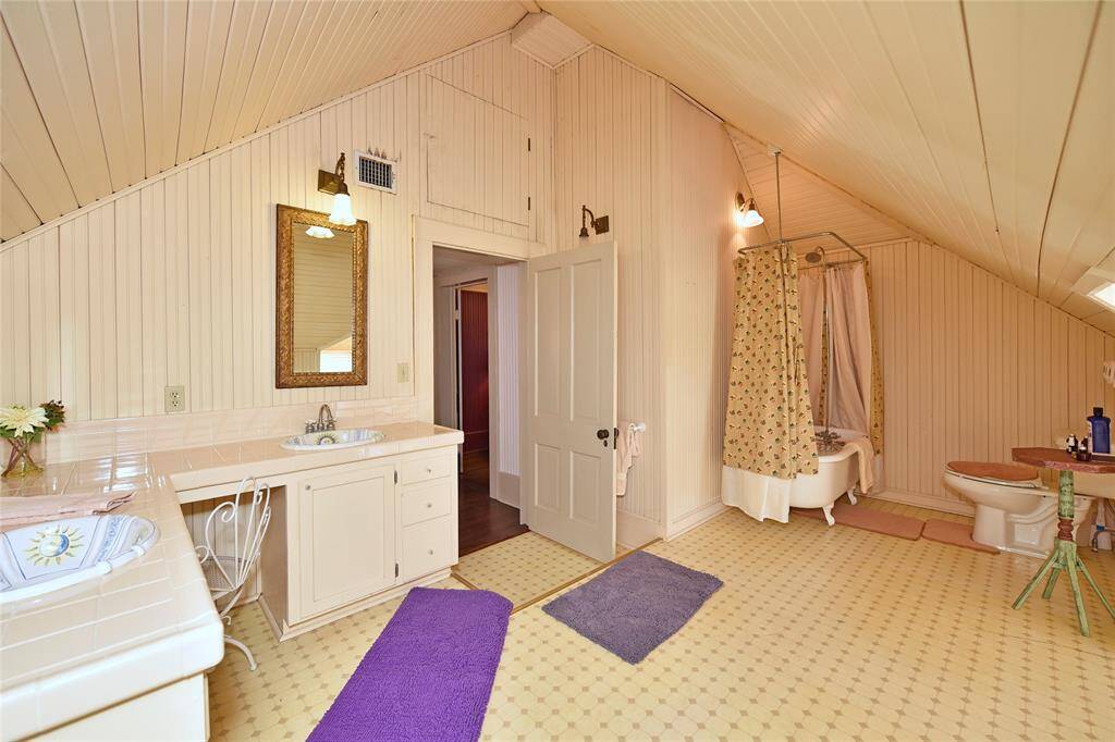This is the upstairs bathroom in the Main house. There is an original claw-foot tub/shower, double vanities and plenty of room.