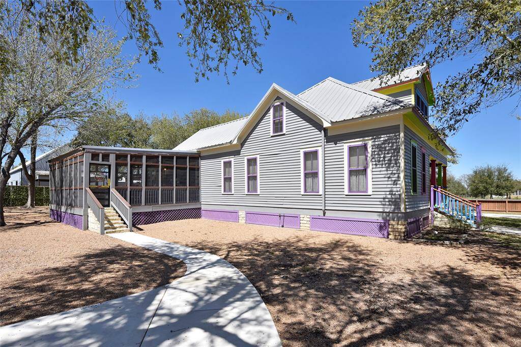 Side view of the Main house. You will notice sidewalks throughout the property.