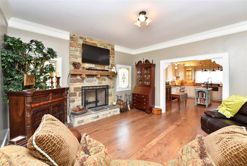 The living room in the Guest house also has a fireplace and is open to the kitchen/dining.
