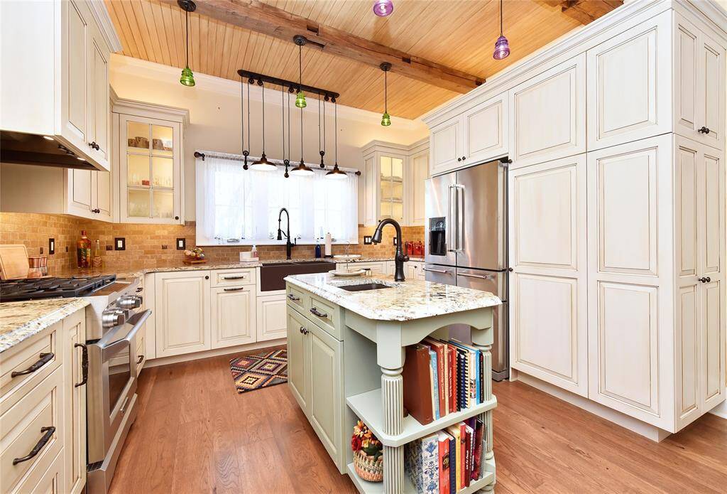 The Guest house kitchen. This home was also remodeled less than 5 years ago. This kitchen has a massive amount of storage. All appliances, art, etc. stay with this home as well.