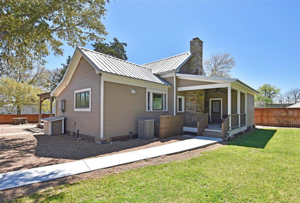The rear of the guest house. The back porch is also covered and has great views of the play area.