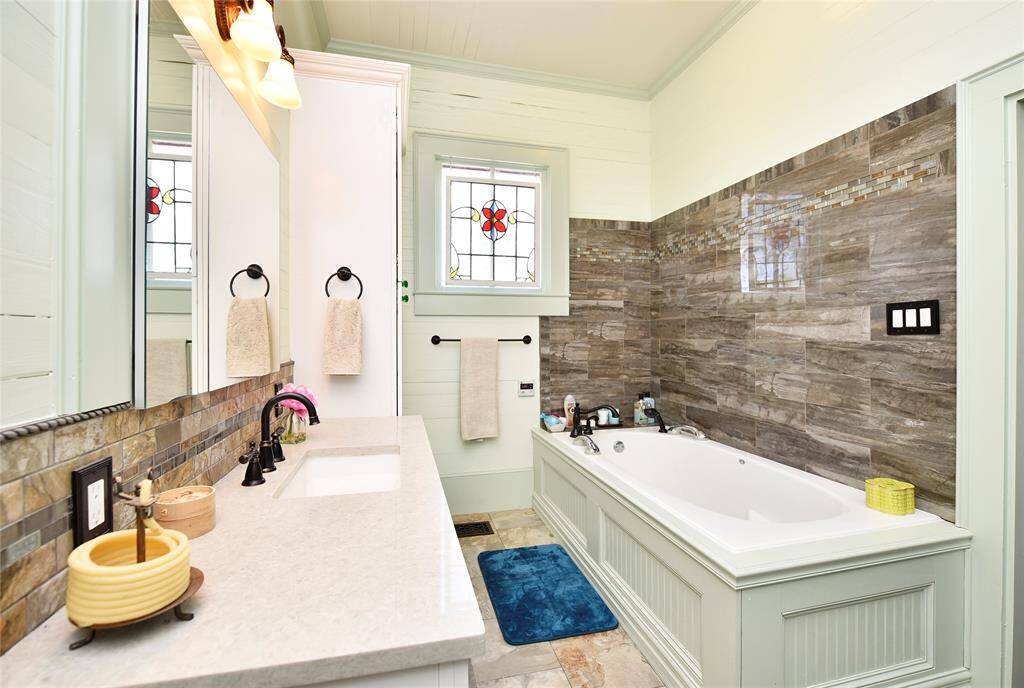The primary bath has been updated with an air-bubble tub and stand alone shower.