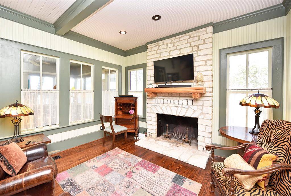 The family room has a stone, wood burning fireplace.