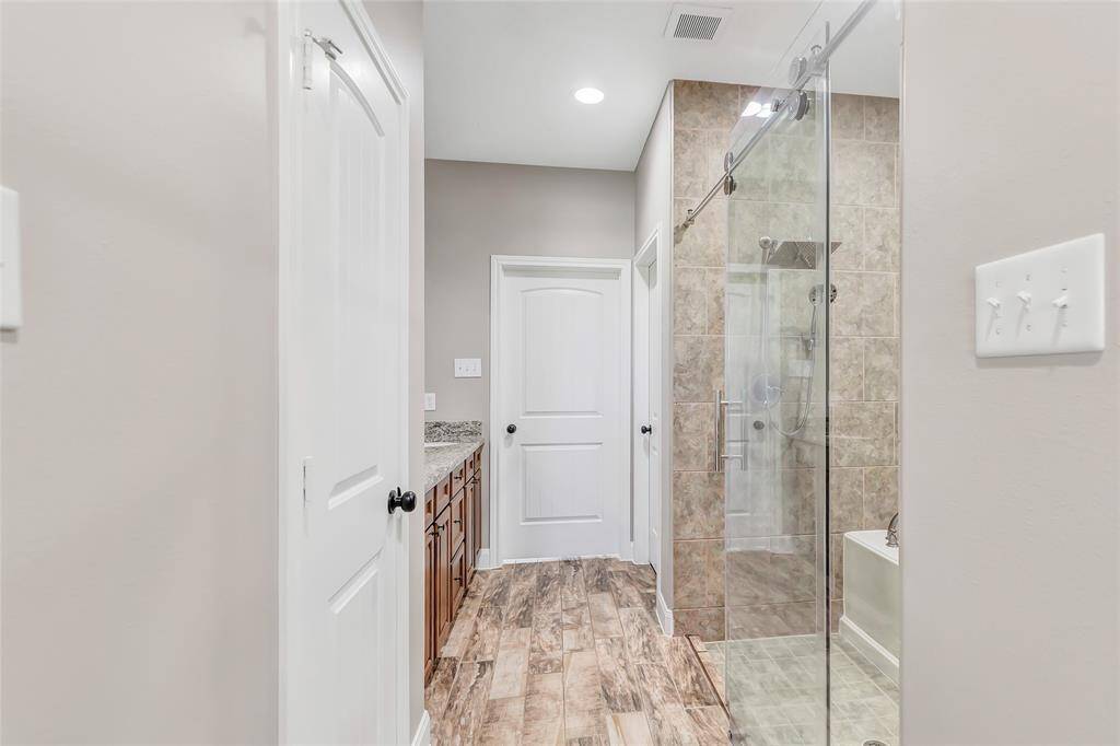 Primary bath with his and hers closets