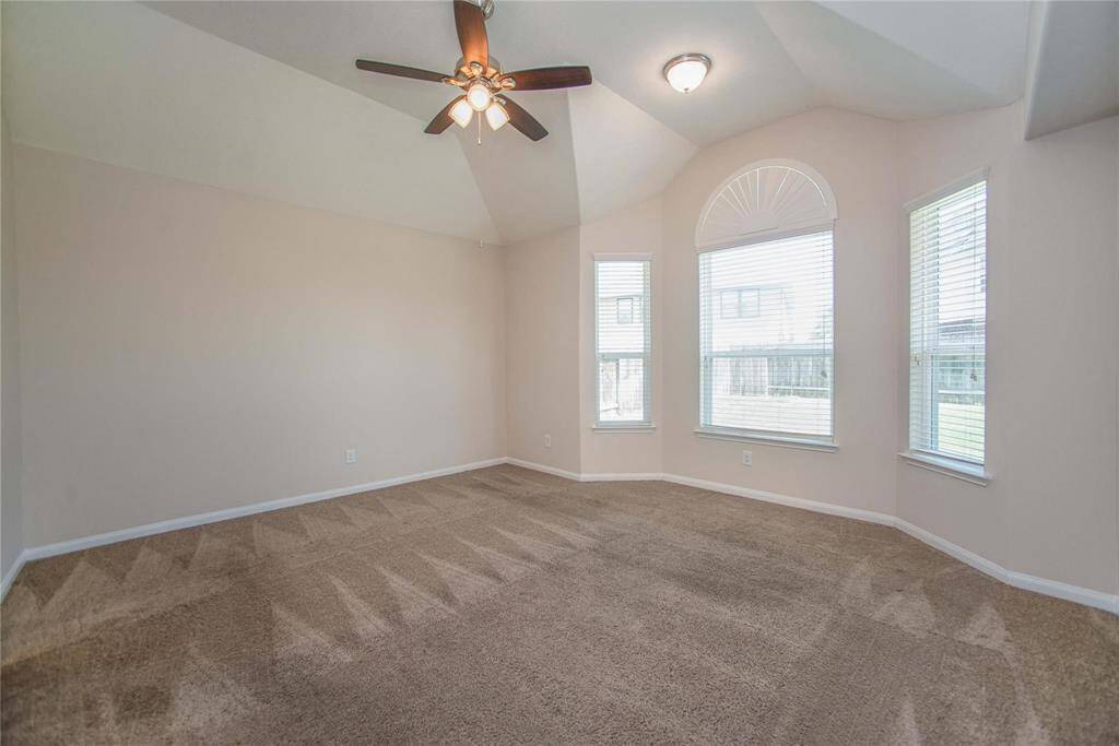 Primary Bedroom is spacious, high ceilings with interesting angles