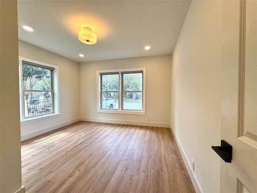The second bedroom faces the street and gets plenty of natural light from the 4 large windows. These windows are double-pane, double-hung thermal windows.