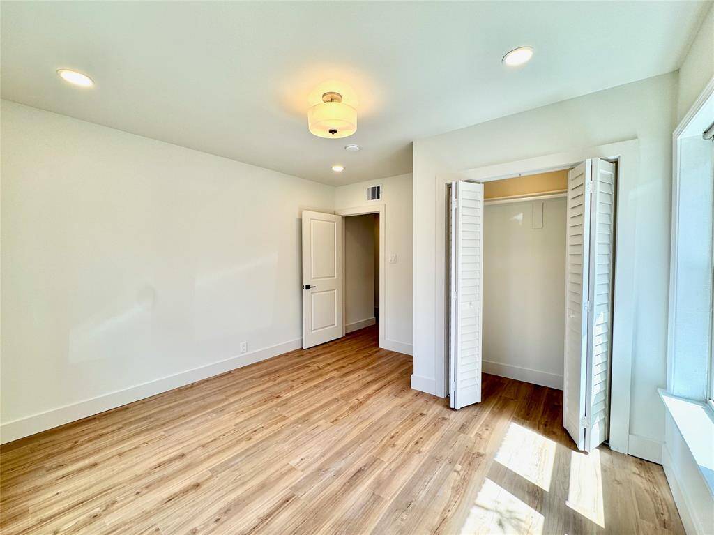 View of the closet and door to the second bedroom.