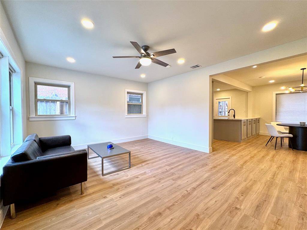 Bright and open living room with plenty of space for entertainment. These windows are double-pane, double-hung thermal windows.