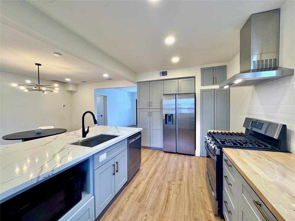 Fully remodeled kitchen offers a new gas range with 4 burners and a center griddle, complete with overhead ventilation. Be the first to enjoy the French door refrigerator with ice-maker and water dispenser, large deep stainless steel sink and dishwasher.