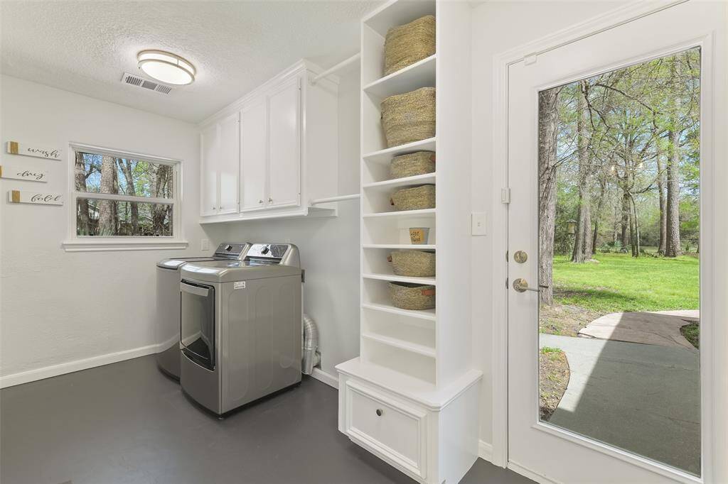 Spacious laundry room with a half bath