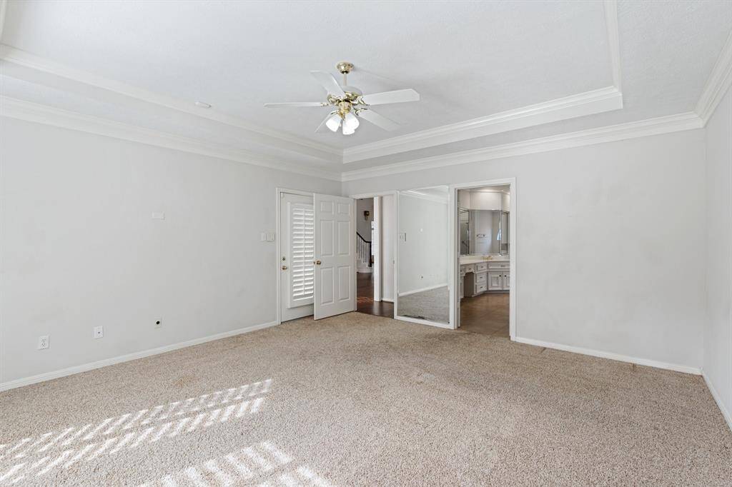 Primary bedroom has it's own private access to the back patio.