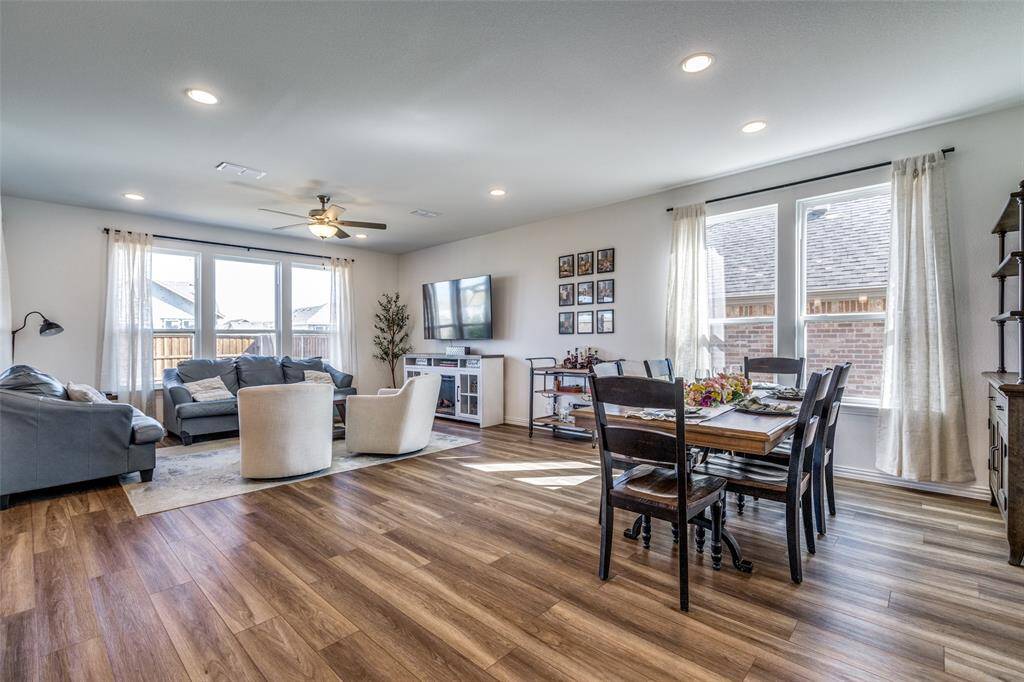 Dining space with recessed lighting, wood finished floors, and ceiling fan